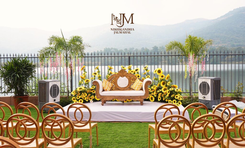 Elegant wedding décor setup at a premium event venue in Pune with floral stage and ambient lighting