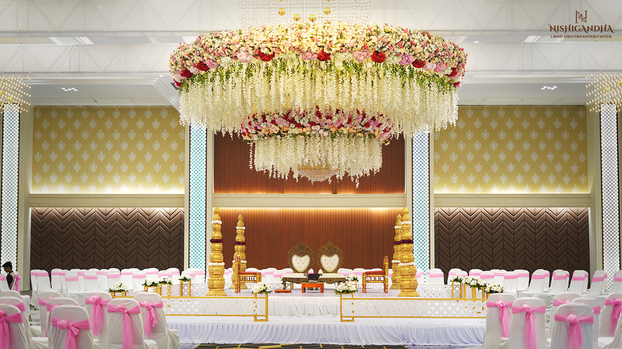 Beautifully decorated wedding mandap with floral arrangements and elegant lighting at a banquet hall in Hinjewadi