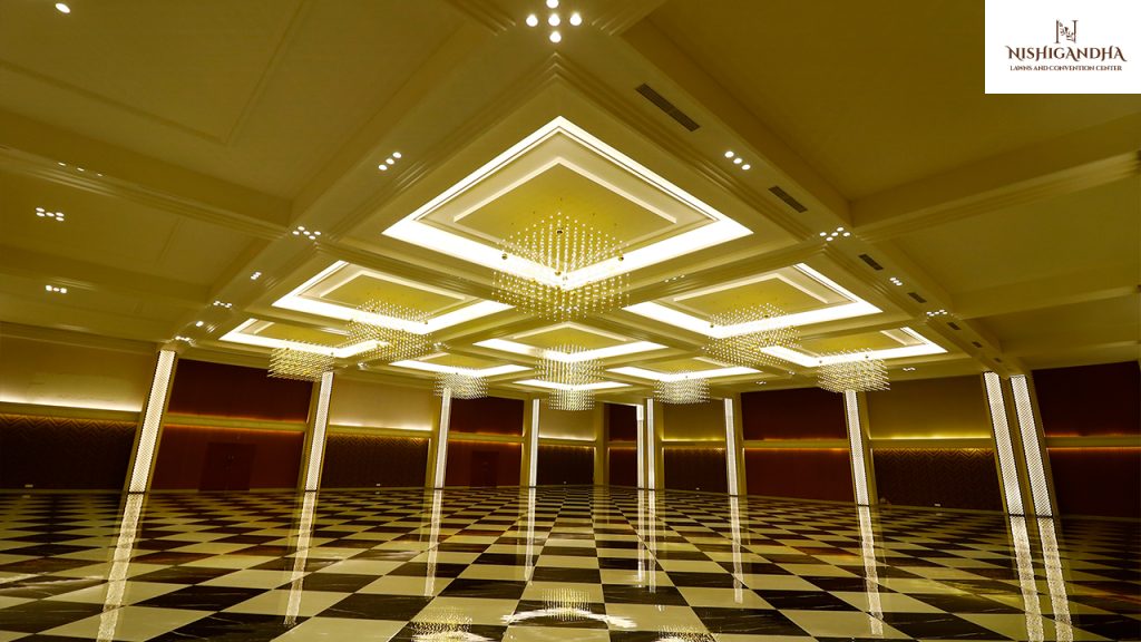 Modern convention centre in Pune hosting a successful corporate event with conference seating, stage setup, and professional business attendees.